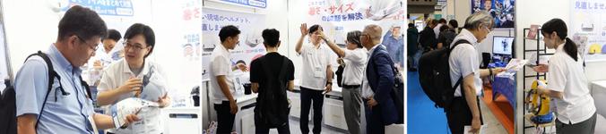 「第12回 猛暑対策展」会場で来場者にヘルメットを紹介する様子